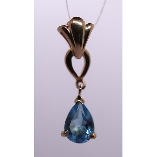 52 - 9ct gold blue topaz gem set drop pendant