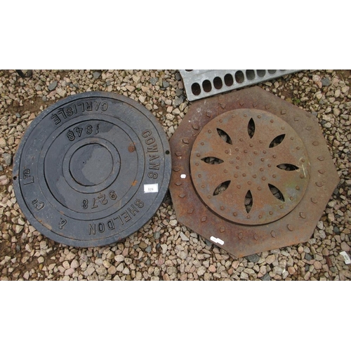 529 - 2 cast iron manhole covers