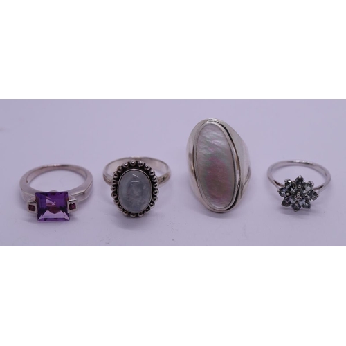 64 - 4 silver rings amethyst, garnet, moonstone & mother-of-pearl