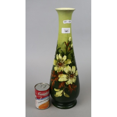 141 - Tall green vase adorned with flowers - Approx height 43cm