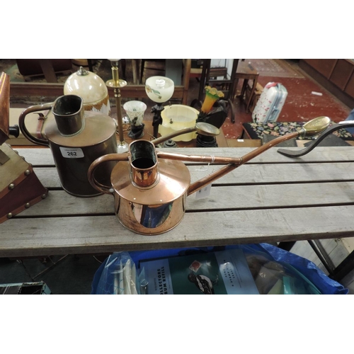 262 - 2 copper bee smokers together with 2 brass & copper indoor watering cans