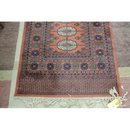 296 - Super Keshan  100% worsted wool Bhokara style pink ground runner carpet. Approx size 90cm x 345cm