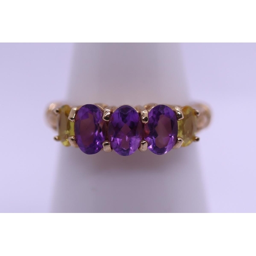 37 - 9ct gold amethyst and yellow sapphire set ring - Size N