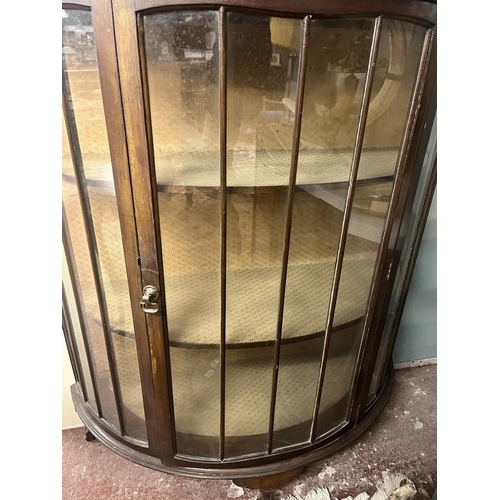 424 - Glass fronted demi lune display cabinet