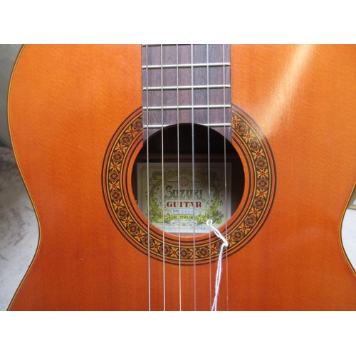 462 - 6 string acoustic Suzuki guitar.