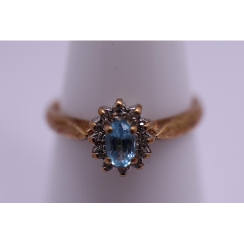62 - 9ct gold aquamarine and diamond set ring - Size L