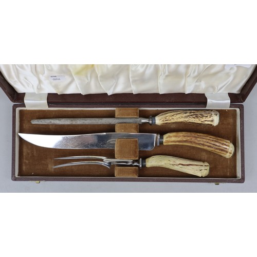 186 - Horn handled carving set in box embossed Castrol