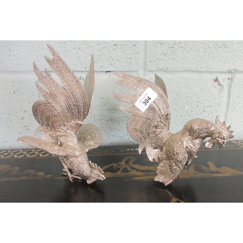 304 - Pair of silver plated fighting cockerels