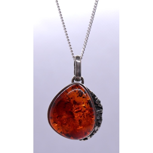 33 - Silver and amber pendant on chain