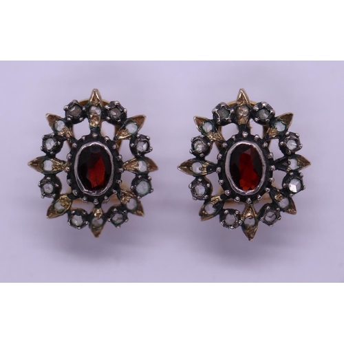 35 - Pair of garnet and diamond pierced earrings