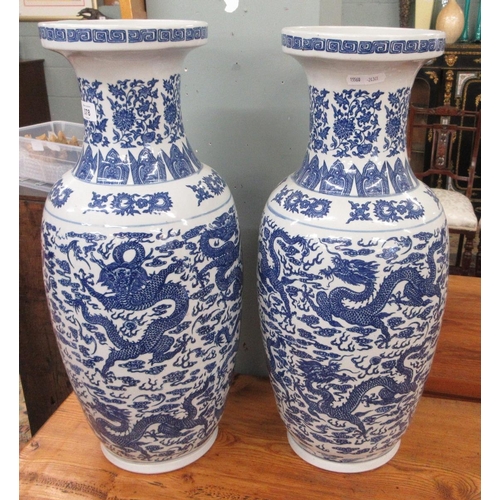 378 - Pair of large Oriental blue & white vases decorated with dragons - Approx Height 60cm