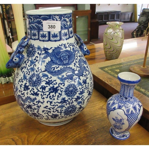 380 - Blue & white oriental vase decorated with dragons together with a small Oriental blue & whit... 