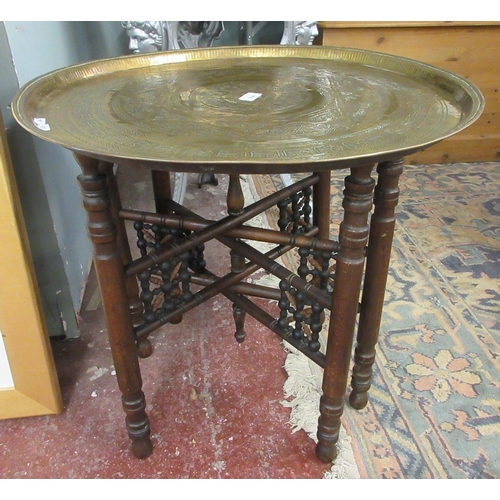 394 - Asian folding hardwood brass topped circular table - 60cm diameter