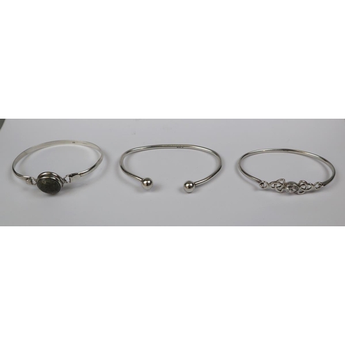 69 - 3 Sterling silver hallmarked bangles, 1 set with Topaz.