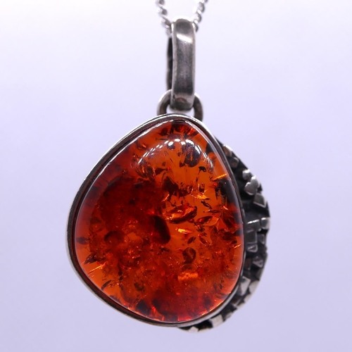 33 - Silver and amber pendant on chain