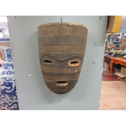 371 - Collection of Eastern carved wood masks etc