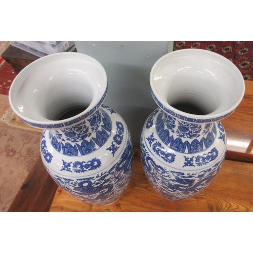 378 - Pair of large Oriental blue & white vases decorated with dragons - Approx Height 60cm