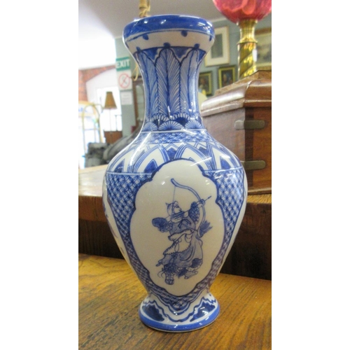 380 - Blue & white oriental vase decorated with dragons together with a small Oriental blue & whit... 