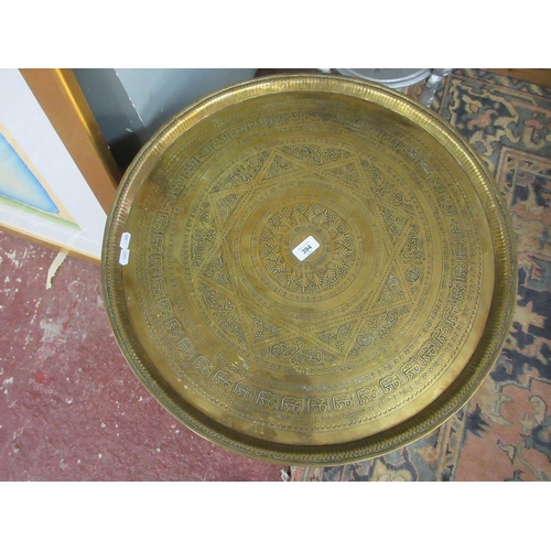 394 - Asian folding hardwood brass topped circular table - 60cm diameter