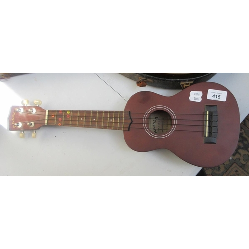 415 - Mandolin in original case together with a Makala ukulele