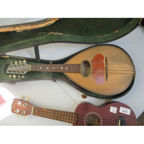 415 - Mandolin in original case together with a Makala ukulele