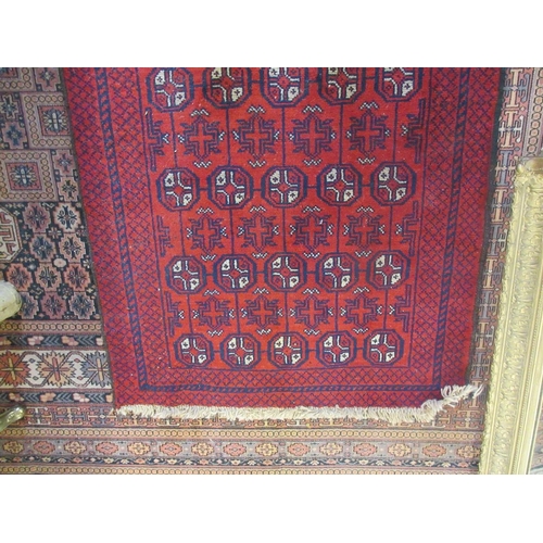 440 - Small red patterned rug - Approx size 150cm x  88cm.