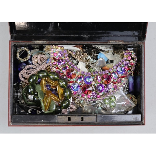 78 - Assorted costume jewellery in vintage tin moneybox.