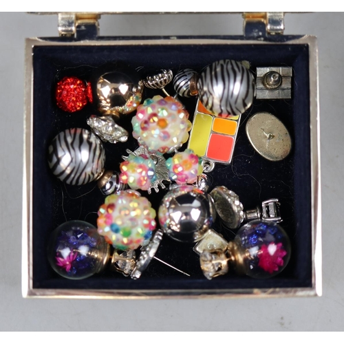 78 - Assorted costume jewellery in vintage tin moneybox.