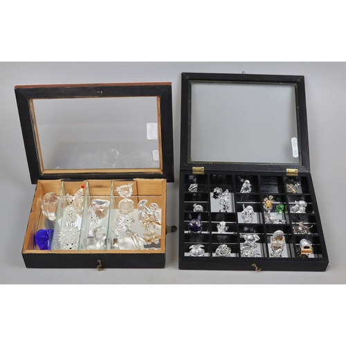 147 - Collection of crystal animals in display cases