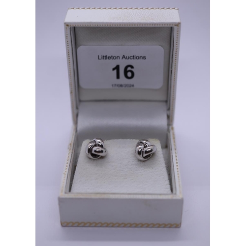 16 - Boxed pair of white gold stud earrings