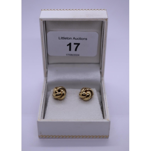 17 - Boxed pair of gold stud earrings