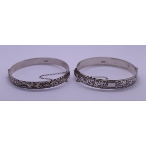 18 - 2 silver bangles