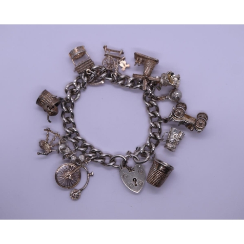 21 - Heavy silver charm bracelet - Approx weight 74.8g