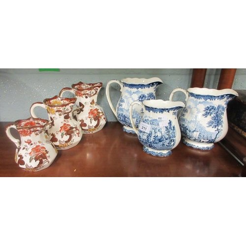 211 - 3 Mason's graduated jugs brown velvet together 3 Palissy Staffordshire blue and white graduated jugs