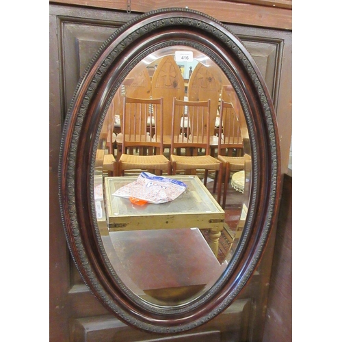 416 - Antique oval mirror with bevelled glass