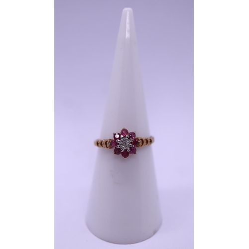 52 - 9ct gold ruby and diamond cluster ring - Size L