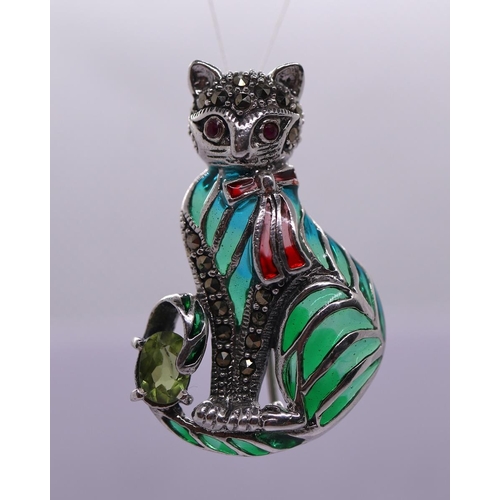 65 - Silver enamel and peridot cat brooch/pendant