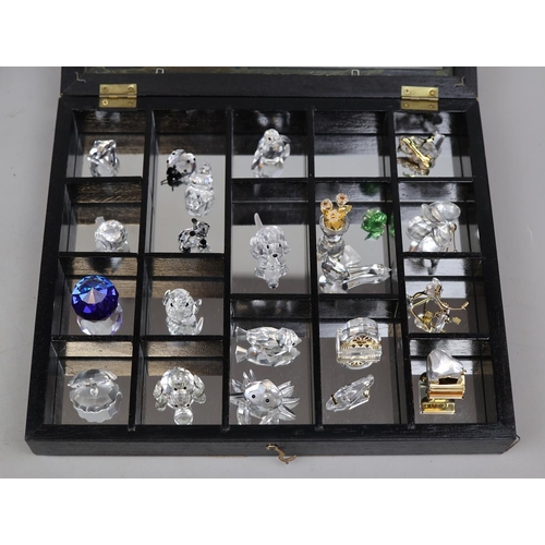 147 - Collection of crystal animals in display cases