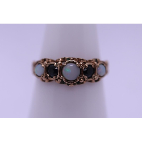 36 - 9ct gold opal and sapphire ring - Size L