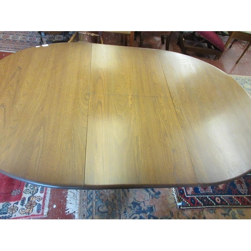 393 - Ercol golden dawn circular extending table - Approx size extended L: 182cm W: 109cm H: 74cm