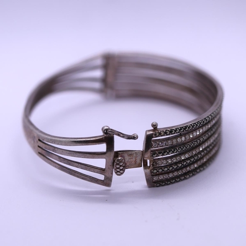 40 - Unusual silver stone set bangle