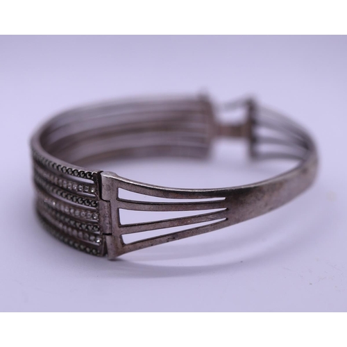 40 - Unusual silver stone set bangle