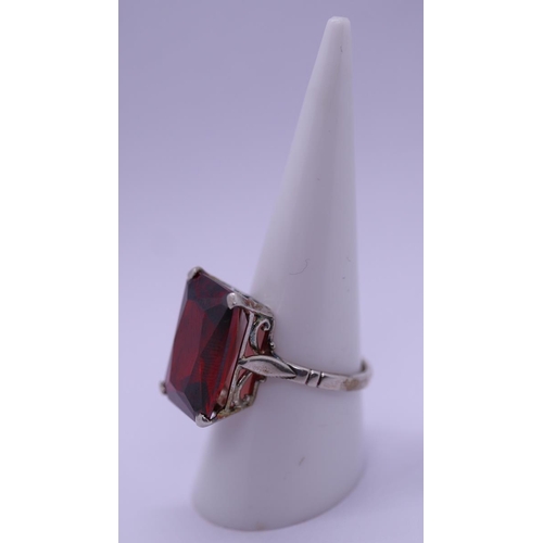 57 - Silver and garnet set ring - Size Q