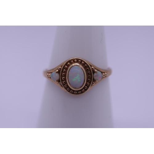 58 - 9ct gold opal set ring - Size N