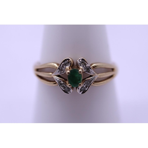 62 - 9ct gold diamond and emerald set ring - Size P