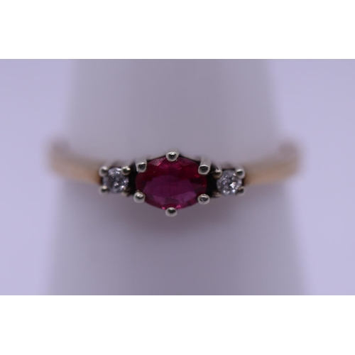 64 - 9ct gold ruby and diamond ring - Size O