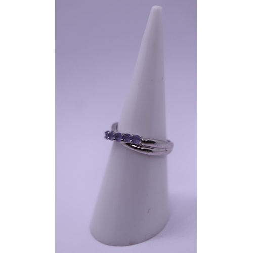 66 - White gold and tanzanite set ring - Size K