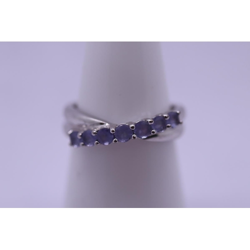 66 - White gold and tanzanite set ring - Size K