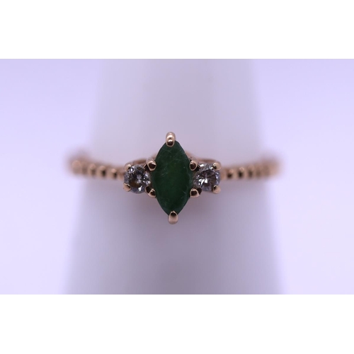 70 - 9ct gold diamond and emerald ring - Size L