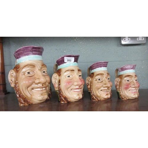 202 - Set of 4 graduated Toby jugs - Approx height of tallest 21cm